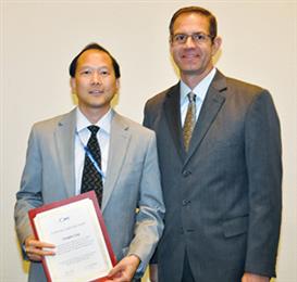 Douglas Eng (left), business development manager of PPG Industries’ (NYSE: PPG) fiber glass business, receives an IPC Committee Leadership Award from John Mitchell, IPC president. The award recognized Eng’s leadership of the IPC 3-12d Woven Glass Reinforcement Task Group that developed IPC-4412B, Specification for Finished Fabric Woven from “E” Glass for Printed Boards.