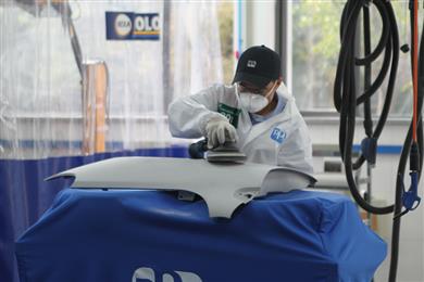 A participant in the Auto Body Painting Contest